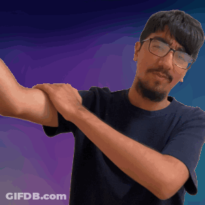 A Man With Glasses And A Beard Is Holding His Arm Up GIF