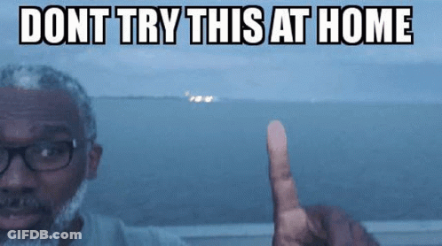 A Man With Glasses And A Beard Is Pointing At Something With The Words " Dont Try This At Home " Written Above Him GIF