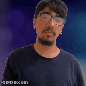 A Man With Glasses And A Beard Is Pointing His Finger At The Camera GIF