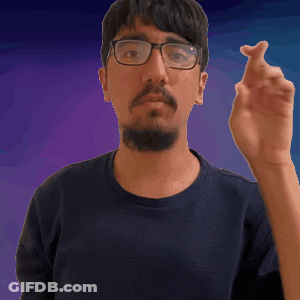 A Man With Glasses And A Beard Is Pointing His Finger GIF