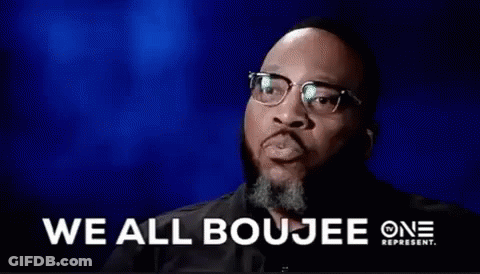 A Man With Glasses And A Beard Is Saying We All Boujee . GIF