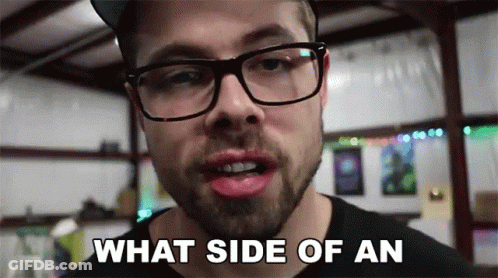 Man With Glasses And Beard Saying What Side Of An GIF