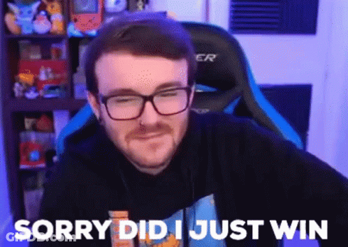 A Man With Glasses And A Beard Is Sitting In A Gaming Chair And Saying Sorry Did I Just Win . GIF