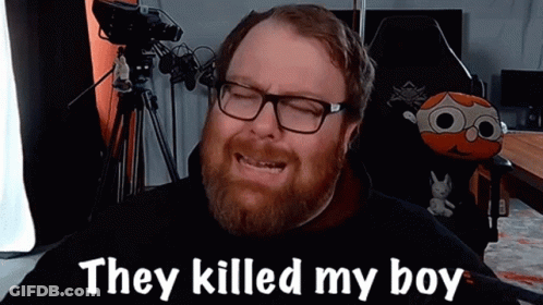 A Man With Glasses And A Beard Is Sitting In Front Of A Camera And Saying They Killed My Boy . GIF