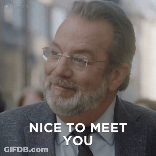 A Man With Glasses And A Beard Is Smiling And Says Nice To Meet You GIF
