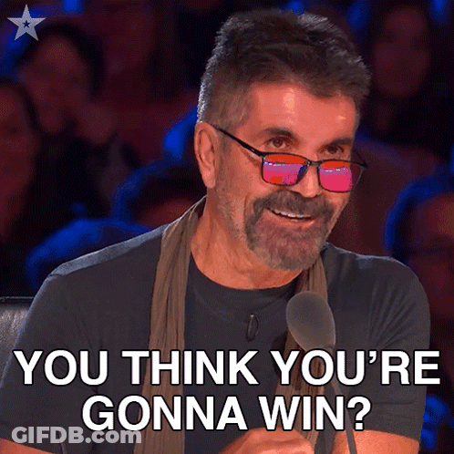 A Man With Glasses And A Beard Is Smiling And Says You Think You 'Re Gonna Win GIF