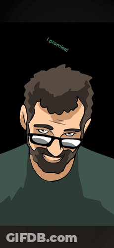 A Man With Glasses And A Beard Is Smiling GIF