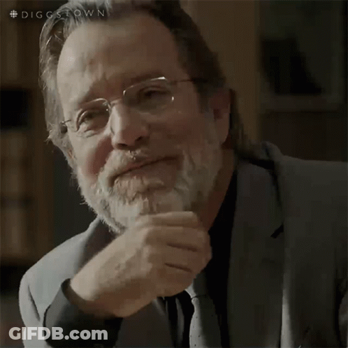 A Man With Glasses And A Beard Is Thinking GIF