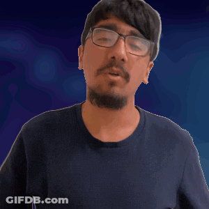 A Man With Glasses And A Beard Is Wearing A Black Shirt GIF