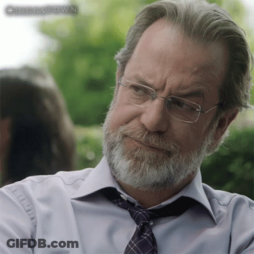A Man With Glasses And A Beard Is Wearing A Shirt And Tie That Says Diggstown On It GIF