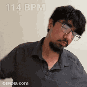 A Man With Glasses And A Beard Is Wearing A Shirt That Says 114 Bpm On It GIF