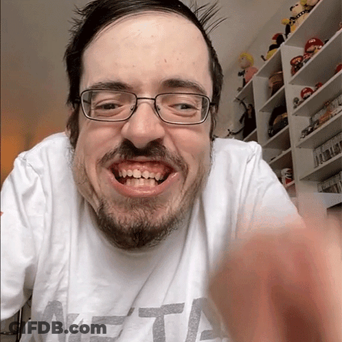 A Man With Glasses And A Beard Is Wearing A Shirt That Says Meta GIF