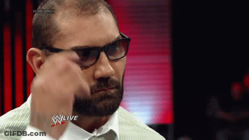 A Man With Glasses And A Beard Is Wearing A White Shirt And Tie GIF