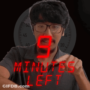 A Man With Glasses And A Beard Is Wearing A Wristwatch That Says 9 Minutes Left GIF