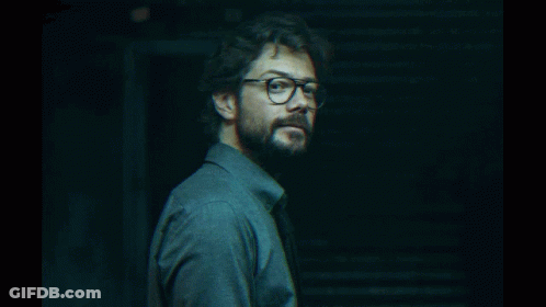 A Man With Glasses And A Beard Looks To The Side GIF