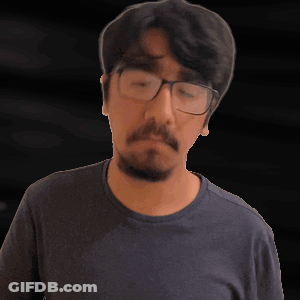 A Man With Glasses And A Beard Looks Up GIF