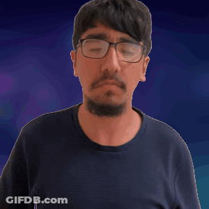 A Man With Glasses And A Beard Making A Surprised Face GIF