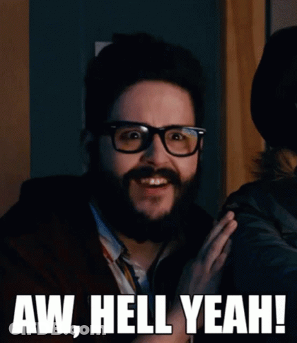 A Man With Glasses And A Beard Says Aw Hell Yeah ! GIF