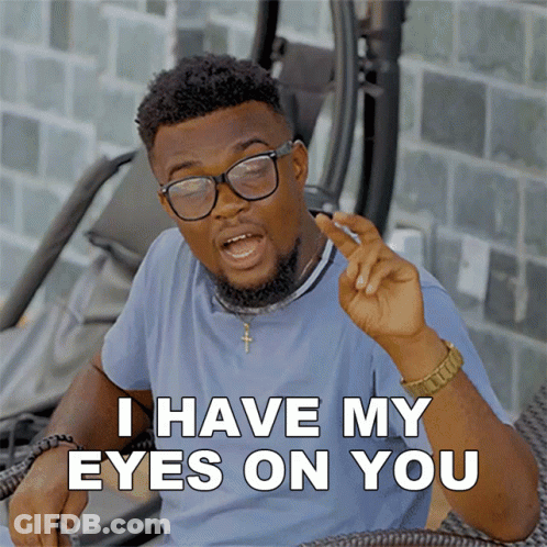 A Man With Glasses And A Beard Says I Have My Eyes On You GIF
