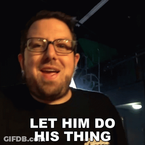 A Man With Glasses And A Beard Says " Let Him Do His Thing " GIF