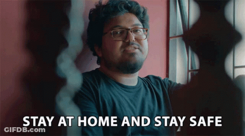 A Man With Glasses And A Beard Says Stay At Home And Stay Safe GIF
