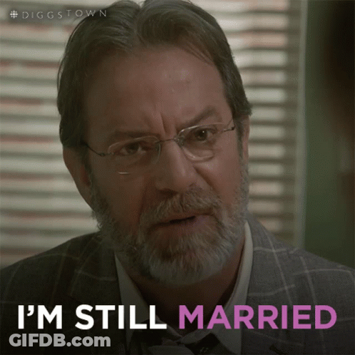 A Man With Glasses And A Beard Says That He Is Still Married GIF