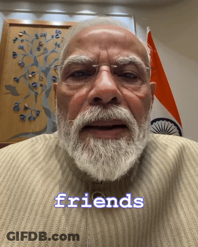 A Man With Glasses And A Beard Says The Word Friends GIF