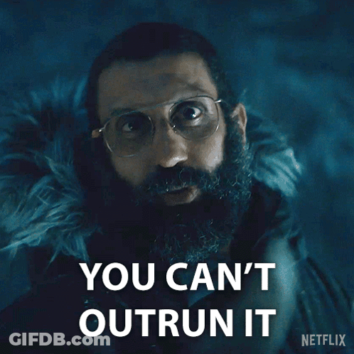 A Man With Glasses And A Beard Says You Can 'T Outrun It On A Netflix Poster GIF