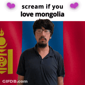 A Man With Glasses And A Beard Stands In Front Of A Mongolia Flag GIF