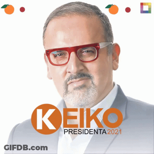 A Man With Glasses And A Beard Stands In Front Of A Sign That Says Keiko GIF
