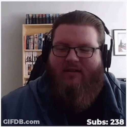 A Man With Glasses And A Beard Wearing Headphones With The Number 238 On The Bottom Right GIF