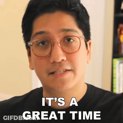 A Man With Glasses And A Black Shirt Says It 'S A Great Time GIF