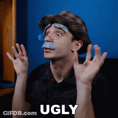 A Man With Glasses And A Fake Mustache Has The Word Ugly On The Bottom GIF