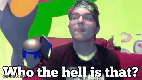 A Man With Glasses And A Headband Is Saying Who The Hell Is That .. GIF
