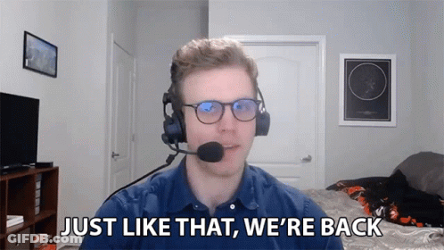 Man With Glasses And Headset Says We're Back GIF