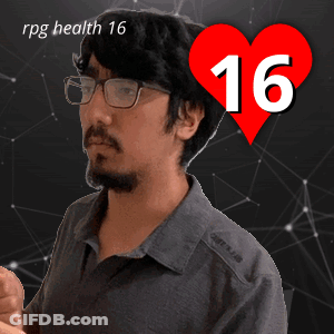 A Man With Glasses And A Heart That Says 16 On It GIF
