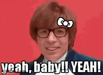 A Man With Glasses And A Hello Kitty Bow On His Forehead Is Saying Yeah Baby ! Yeah ! GIF