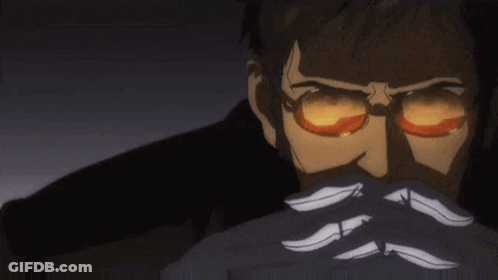 A Man With Glasses And A Mustache Is Covering His Face With His Hands In A Dark Room . GIF
