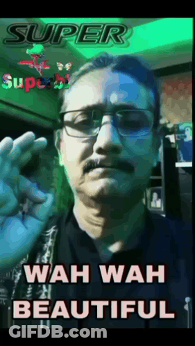 A Man With Glasses And A Mustache Is Giving An Ok Sign GIF