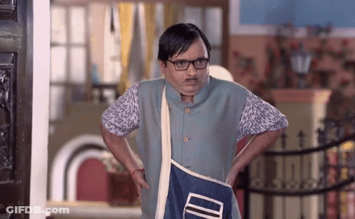 A Man With Glasses And A Mustache Is Holding A Blue Bag That Says ' Id ' On It GIF