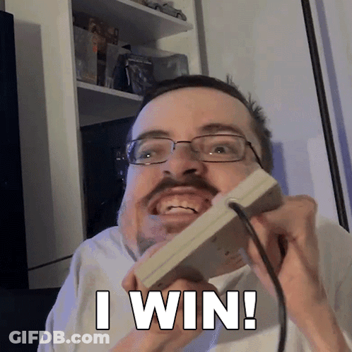 A Man With Glasses And A Mustache Is Holding A Nintendo Game Controller And Says I Win GIF