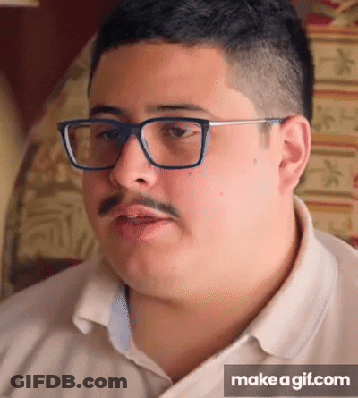 A Man With Glasses And A Mustache Is Making A Funny Face On Make A Gif.com GIF