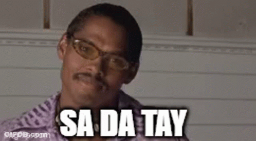 A Man With Glasses And A Mustache Is Smiling With The Words `` Sa Da Tay '' Above Him . GIF