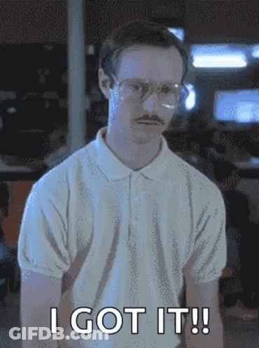 A Man With Glasses And A Mustache Is Standing In A Room And Says `` I Got It '' . GIF