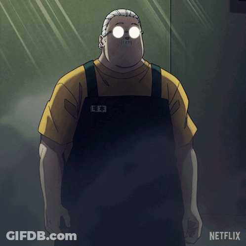 A Man With Glasses And A Mustache Is Standing In Front Of A Netflix Logo GIF