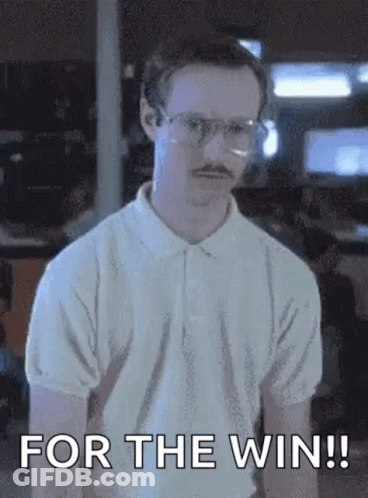 A Man With Glasses And A Mustache Is Standing In Front Of A Wall And Saying `` For The Win ! '' GIF