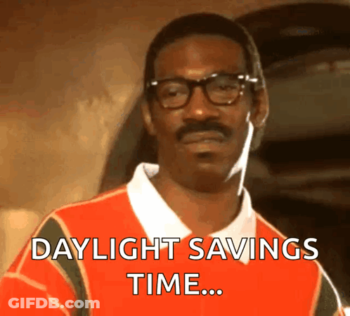 A Man With Glasses And A Mustache Is Wearing A Shirt That Says Daylight Savings Time GIF