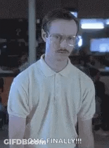 A Man With Glasses And A Mustache Is Wearing A White Polo Shirt And A White Shirt . GIF
