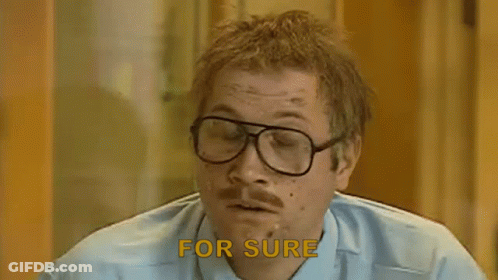 A Man With Glasses And A Mustache Says `` For Sure '' While Smoking A Cigarette . GIF