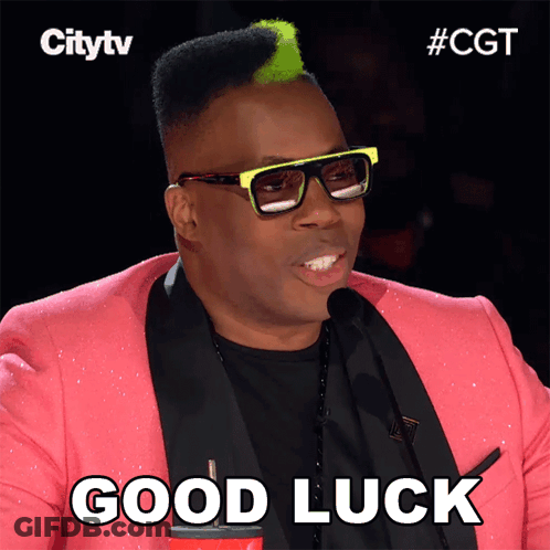 A Man With Glasses And A Pink Jacket Says " Good Luck " GIF